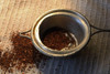 image of loose leaf Rooibos tea in a tea strainer